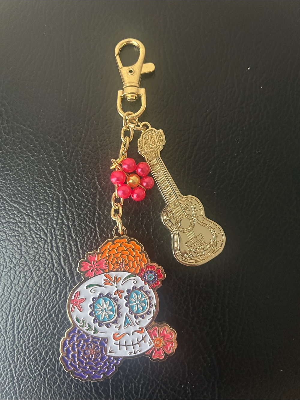 Disney Gold-Tone Guitar & Skull Charm Keychain with Pink Flower Beads